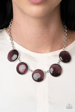 Load image into Gallery viewer, Featuring sleek silver fittings, a collection of round purple cat&#39;s eye stone pendants link below the collar for a colorfully ethereal look. Features an adjustable clasp closure.  Sold as one individual necklace. Includes one pair of matching earrings.