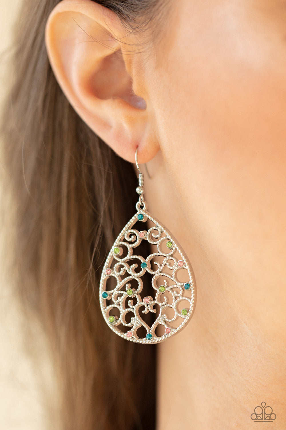 Dotted with dainty multicolored rhinestones, studded silver filigree vines across the front of a silver teardrop frame for an enchanting look. Earring attaches to a standard fishhook fitting.  Sold as one pair of earrings.