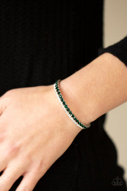 Mismatched strands of glassy white and glittery green rhinestones stack into a dainty cuff around the wrist, creating a sparkly centerpiece.  Sold as one individual bracelet.