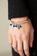 Load image into Gallery viewer, Glassy blue stone beads and silver floral charms stamped in the words, &quot;faith,&quot; &quot;hope,&quot; and &quot;peace,&quot; glide along a dainty bangle-like cuff around the wrist for a whimsical flair. Features an adjustable toggle closure.  Sold as one individual bracelet.