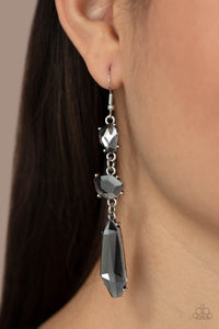 Featuring raw cuts, an asymmetrical collection of faceted smoky gems trickles from the ear, creating a smoldering chandelier. Earring attaches to a standard fishhook fitting.  Sold as one pair of earrings.