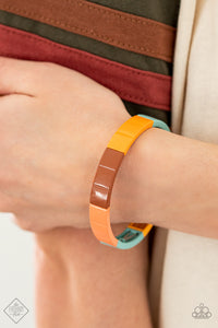 Metal rectangles painted in the spring Pantone® shades of Cerulean, Rust, Marigold, and Burnt Coral are threaded along stretchy bands, forming a gorgeous spectrum of color that wraps around the wrist.  Sold as one individual bracelet.