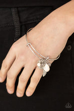 Load image into Gallery viewer, Featuring a shimmery silver feather charm, ornate silver beads and earthy white stone beads glide along the fitted center of a dainty silver bangle for a whimsically charming look.  Sold as one individual bracelet.
