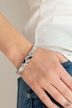 Load image into Gallery viewer, A jumble of dazzling blue and white rectangle-shaped rhinestones mingle with small blue sparkling rhinestones atop a modern stamped silver cuff.  Sold as one individual bracelet.