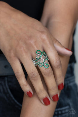 Glistening silver bars and green rhinestone encrusted bars delicately swirl across the finger, billowing into a sparkly centerpiece. Features a stretchy band for a flexible fit.  Sold as one individual ring.