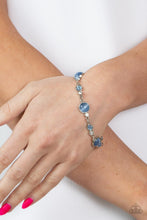 Load image into Gallery viewer, Encased in sleek silver fittings, a bubbly collection of blue cat&#39;s eye stones and glassy white rhinestones coalesce into mismatched frames that delicately connect around the wrist for an effervescent elegance. Features an adjustable clasp closure.  Sold as one individual bracelet.