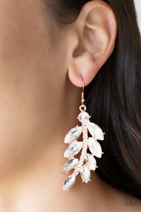 Oversized marquise cut white rhinestones fan out from a curved shiny copper bar encrusted in glassy white rhinestones, resulting into a glamorously leafy statement piece. Earring attaches to a standard fishhook fitting.  Sold as one pair of earrings.