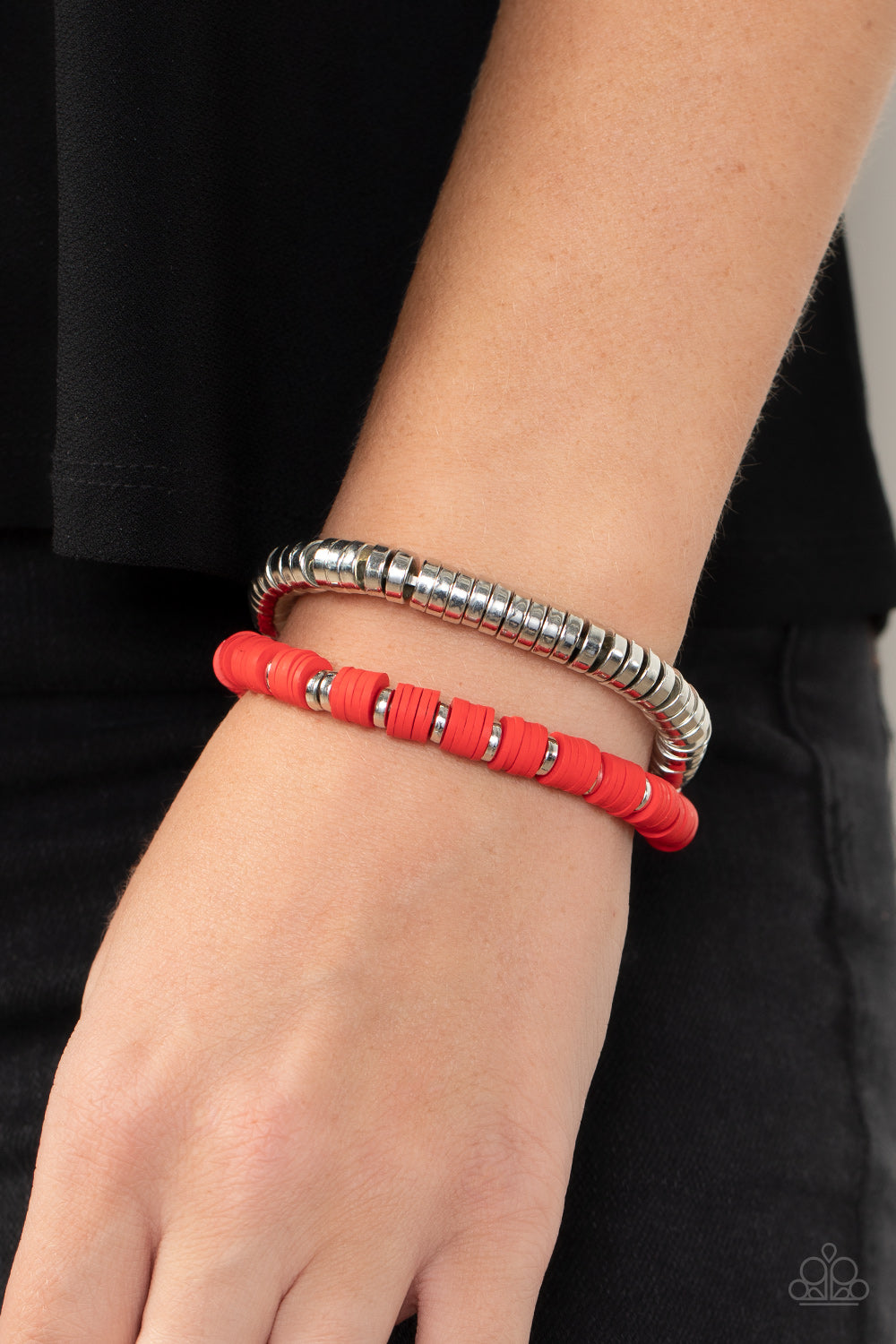 Infused with stretchy bands, a row of silver disc beads joins a strand of rubbery red and silver discs around the wrist, resulting in a modern duo.  Sold as one individual bracelet.