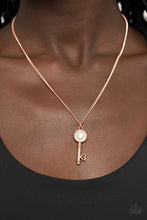 Load image into Gallery viewer, Bordered in glassy white rhinestones, an opal white rhinestone adorns a shiny copper key pendant at the bottom of a dainty shiny copper chain for a whimsical fashion. Features an adjustable clasp closure.  Sold as one individual necklace. Includes one pair of matching earrings.  New Kit