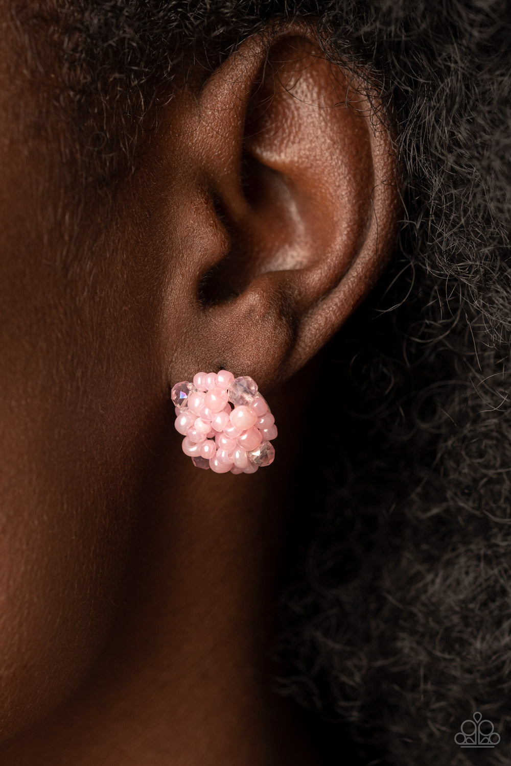 The front of a dainty silver frame is embellished in pearly pink seed beads and pink crystal-like accents, creating a bubbly pop of color. Earring attaches to a standard post fitting.  Sold as one pair of post earrings.