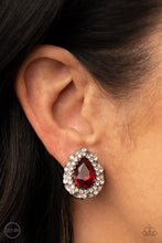 Load image into Gallery viewer, An oversized red teardrop gem is elegantly bordered in glassy white rhinestones atop a decorative silver frame, culminating into a timeless twinkle. Earring attaches to a standard clip-on fitting.  Sold as one pair of clip-on earrings.