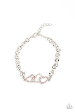 Load image into Gallery viewer, Pink and white rhinestone dotted hearts delicately interlock between two white rhinestone fittings, creating heart-pounding sparkle atop the wrist. Features an adjustable clasp closure.  Sold as one individual bracelet.