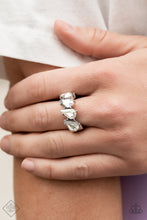 Load image into Gallery viewer, Paparazzi Accessories  - A row of brilliant white teardrop rhinestones encased in silver pronged fittings are tilted on an angle as they connect across the finger making an impressive swoon-worthy statement. Features a dainty stretchy band for a flexible fit.  Sold as one individual ring.