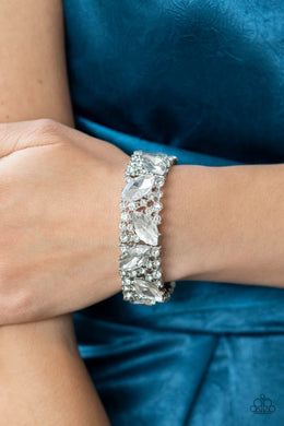 Oversized marquise cut white rhinestones sparkle atop icy frames of dainty silver studs and white rhinestones that are threaded along stretchy bands around the wrist for a jaw-dropping dazzle.  Sold as one individual bracelet.